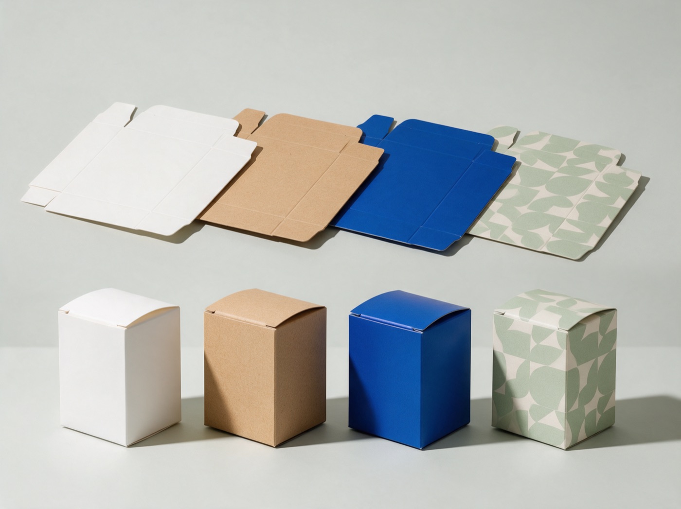 Tuck-top folding cartons, flat and made up, in white, kraft, cobalt and sage